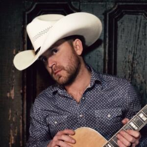 Justin Moore ne music cowboy hat guitar pose singing